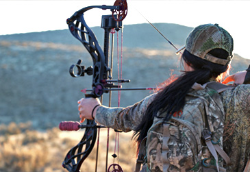 archer pulling back bowstring